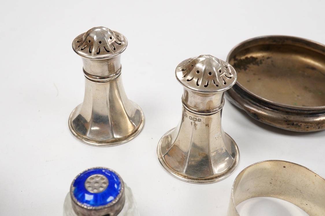 A collection of assorted silver to include five napkin rings including two pairs, a cased pair of glass butter dishes with silver butter knives, five golf related teaspoons, a cased set of six sterling cocktail sticks wi